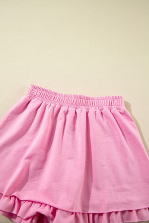 Pink cotton co-ord set skirt with elastic waistband and ruffled hem