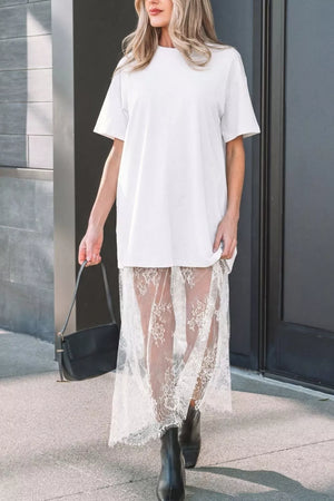 White cotton midi t-shirt dress with sheer lace overlay skirt and short sleeves.