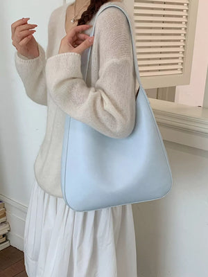 Sleek blue pu leather shoulder bag with a smooth finish.