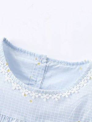 Baby dress with blue gingham, yellow dots, and white lace trim.
