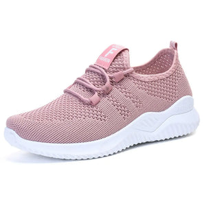 Pink breathable knit runner sneaker with white sole and logo detail.