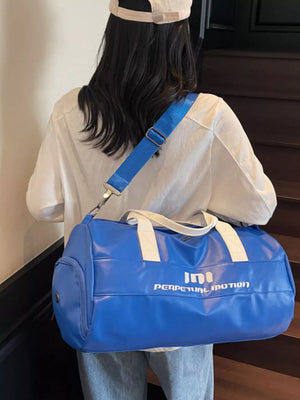 Vibrant blue pu leather sporty duffel bag with white graphic and handles, adjustable strap.