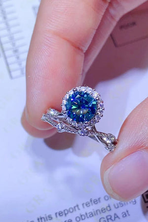 Celestial Halo Moissanite Engagement Ring Set in Sky Blue with diamond accents.