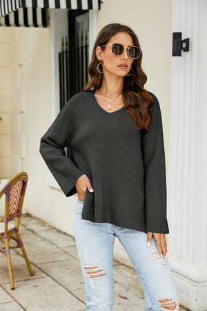 Black relaxed fit v-neck knit pullover sweater with ribbed cuffs and hem.