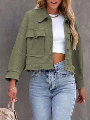 Moss waffle knit cropped utility jacket with buttoned chest pockets and collar.