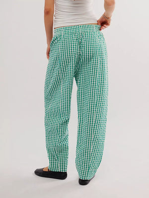 Green gingham check wide-leg pants with pockets, shown from the back.