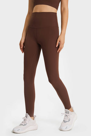 Brown high rise leggings with a seamless waistband and subtle side seam detail.