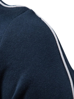 Navy track jacket with white stripe detail on shoulder and sleeve.