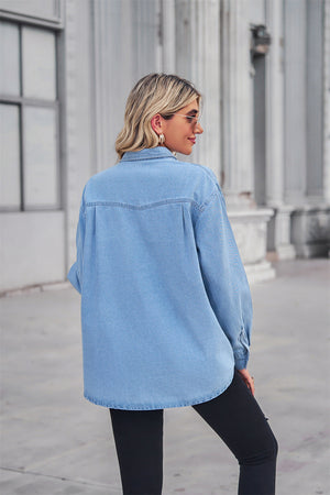 Light wash oversized denim shirt with patch pockets, collared neck, and buttoned front.