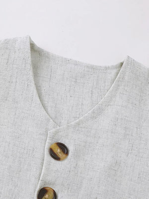 Baby vest set in light grey linen-look fabric with tortoiseshell buttons.
