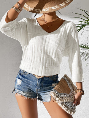 White textured knit dolman sleeve top with V-neck and 3/4 sleeves.