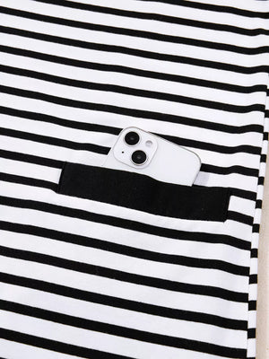 Black and white striped collared dress with button detail and functional pocket holding a phone.