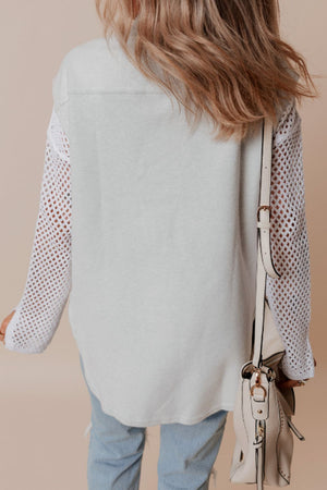 Light gray utility vest with contrast white crochet sleeves and button-down front.