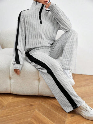Light gray ribbed lounge set with contrast black stripe down the side of the pants and sleeve.