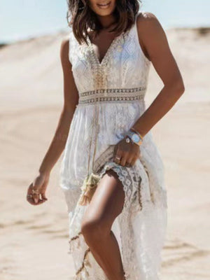 White lace V-neck maxi dress with embroidered waist detail and lace trim.