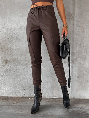 Chocolate cargo joggers with elasticated waist and drawstring, featuring multiple pockets.