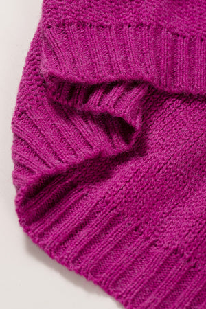 Colorblock ribbed knit pullover in magenta acrylic with a textured pattern.