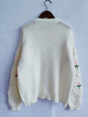 Cream bobble stitch cardigan with embroidered floral sleeves and pearl buttons