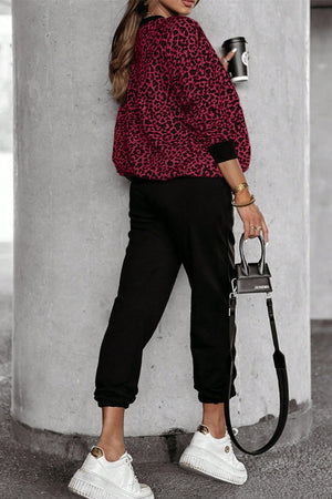 Burgundy leopard print loungewear set with black joggers and a matching top.