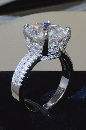 Silver moissanite crown ring with pavé band detail and a large center stone.