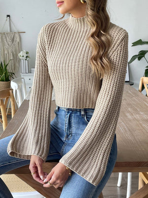Khaki ribbed knit crop sweater with bell sleeves and mock neck.
