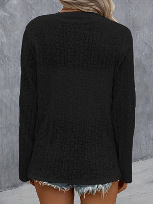 Black open-weave long sleeve cardigan with a draped front and textured pattern.