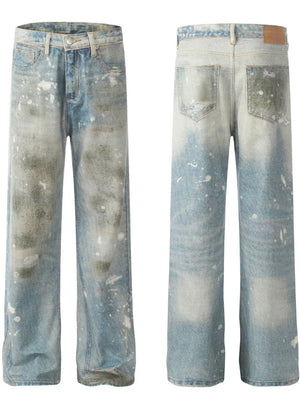 Distressed wash wide leg denim jeans in medium blue with paint splatters and faded details.