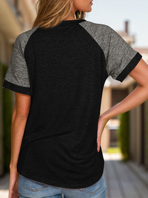 Raglan sleeve tee in black with heather gray sleeves and trim.