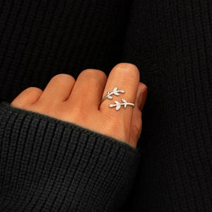Silver ring with delicate zirconia leaves and vine design