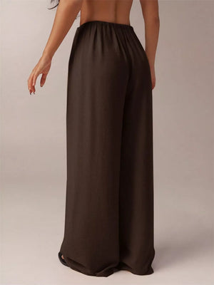 Brown relaxed wide-leg maternity pants with elastic waistband.