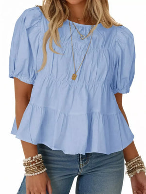 Sky blue maternity blouse with puff sleeves, ruffled tiers, and smocked bodice detail.