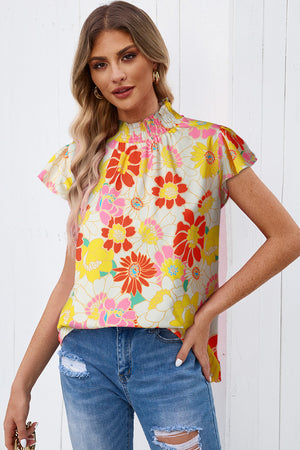 Floral smocked neckline blouse with flutter sleeves and a retro floral print.