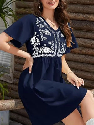 Navy embroidered floral v-neck mini dress with flutter sleeves.