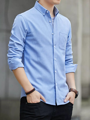 Light blue cotton button-down casual shirt with a chest pocket and buttoned collar.