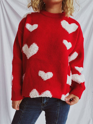Red acrylic sweater with textured white heart appliqués, crew neck, long sleeves.