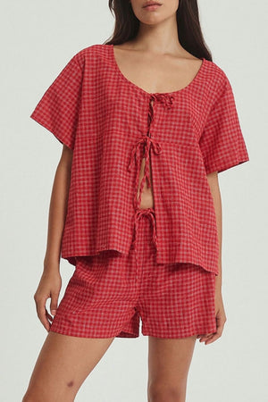 Open-front plaid cotton top with tie closure and matching shorts in deep red.