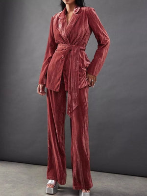Velvet belted blazer and wide leg trousers in burgundy, styled with silver platform heels.