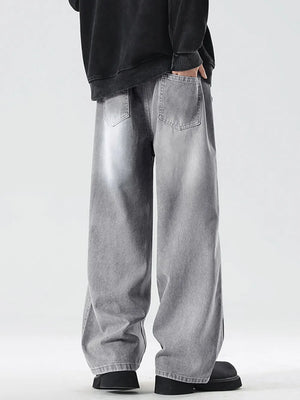 Oversized drawstring washed denim jeans in cement gray with a relaxed fit.