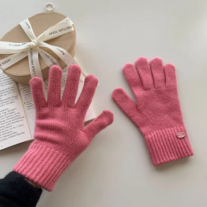 Dusty Pink wool knit gloves with ribbed cuffs and button detail.