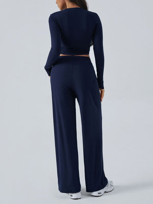 Dark blue ribbed knit crop top and wide leg pants set from behind.