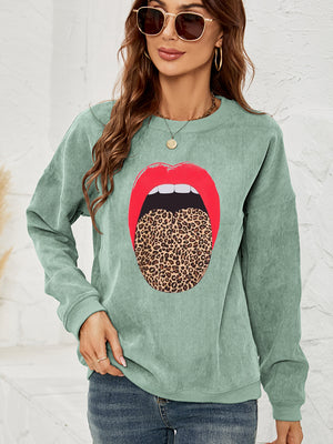 Light green corduroy crewneck sweatshirt with a red lip and leopard tongue print.