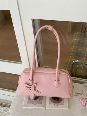 Pink shoulder bag with star charm and double handles