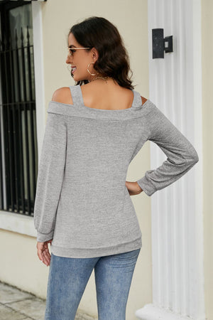 Gray long sleeve sweater with cold shoulder cutouts and square neckline.