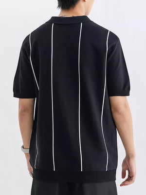 Black knit polo shirt with white vertical stripes and ribbed hem.