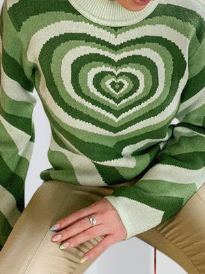 Light green knit sweater with a heart stripe pattern and mock neck.