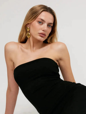Gold sculpted geo drop earrings with geometric shapes.