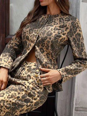 Leopard print denim bolero jacket with button-up front and collarless neckline.