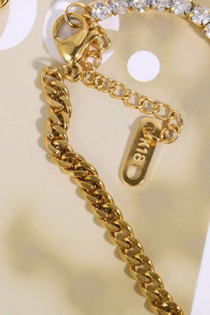 Gold dual-chain zirconia tennis bracelet with lobster clasp and adjustable extender chain.