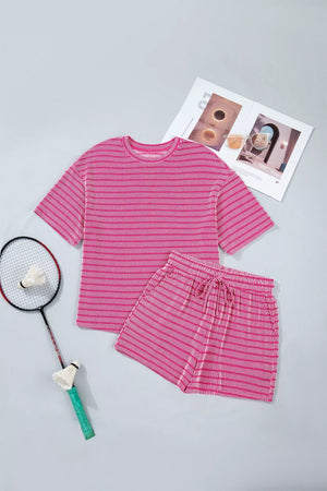 Fuchsia pink striped two-piece short set with drawstring shorts and crew neck top.