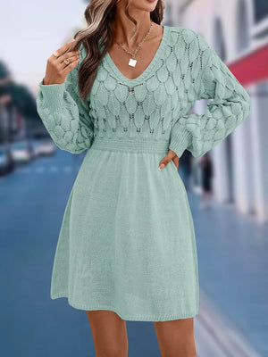 Teal openwork knit V-neck sweater dress with cinched waist and above-knee length.